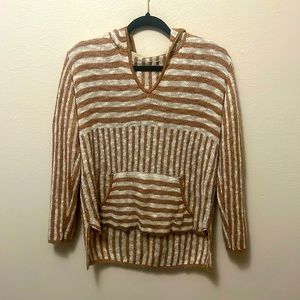 It’s a warm comfy sweater! It has like brown tan stripes with some cream color!